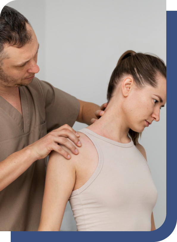 A frozen shoulder chiropractor assessing shoulder alignment and mobility to treat a patient